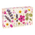 Rectangular soap with pressed flowers on a white background
