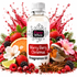 A bottle of Fizzy Whiz Merry Berry Christmas Fragrance Oil centered on a white background, surrounded by festive berries, citrus slices, cinnamon sticks, a pink flower, and a small robin wearing a Santa hat. Red liquid splashes burst behind the bottle.