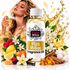A bottle of Fizzy Whiz 'Miss Million' fragrance oil is centered in a styled commercial composition. The bottle is surrounded by fragrance ingredients including lemons, raspberries, vanilla beans, cinnamon sticks, and white flowers.