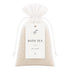 Bag of bath tea with a label on a white background