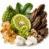 A styled arrangement of natural ingredients on a white background, including a green bergamot-like citrus fruit, a sliced lime, a curled lime peel, amber crystalline sugar, white sugar cubes, and dark brown bark pieces.