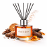 Diffuser bottle labeled 'Oud & Spice' with aromatic elements on a white background