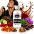 A bottle of Fizzy Whiz Oud & Spice Fragrance Oil centered on a white background, surrounded by scent ingredients including cinnamon sticks, amber resin, cloves, nutmeg, red berries, purple flowers, green leaves, bark, and a man holding a perfume spray bottle. A glossy brown spice splash graphic appears behind the bottle.