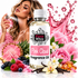 A bottle of Fizzy Whiz Pink Cloud Fragrance Oil centered in a promotional composition, surrounded by pink flowers, fruit slices, berries, vanilla beans, and a woman holding a perfume bottle in the background. The bottle label reads 'Pink Cloud Fragrance Oil' and the brand 'Fizzy Whiz' is clearly visible.