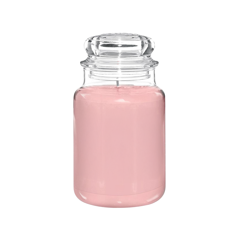 A jar of Pink Sands fragrance oil, with a clear glass jar and a pink liquid inside.