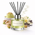 Pistachio Gelato diffuser with pistachios, flowers, and vanilla beans on a white background