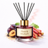 Reed diffuser labeled 'Plum & Rhubarb' with plums and rhubarb on a white background