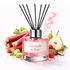 Reed diffuser labeled 'Rhubarb & Pear' with rhubarb, pear, and raspberry ingredients on a white background