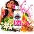 A bottle of Fizzy Whiz Rio Fragrance Oil centered on a white background, surrounded by fragrance ingredients and a woman holding a pink spray bottle. Visible elements include a pear, lime, orchid, cinnamon sticks, vanilla beans, amber beads, and a pink splash graphic.