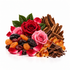 A styled arrangement of edible ingredients on a white background: two roses in red and pink, green leaves, dried cranberries and apricots, dark chocolate pieces, amber crystalline sugar, and brown bark-like pieces.
