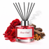 Red diffuser bottle labeled 'Rose Oud' with rose flowers and wood elements on a white background
