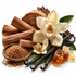 Natural vanilla extract ingredients arranged on a white background, including vanilla beans, vanilla flowers, cinnamon sticks, a wooden bowl of ground vanilla, green leaves, and amber sugar crystals.