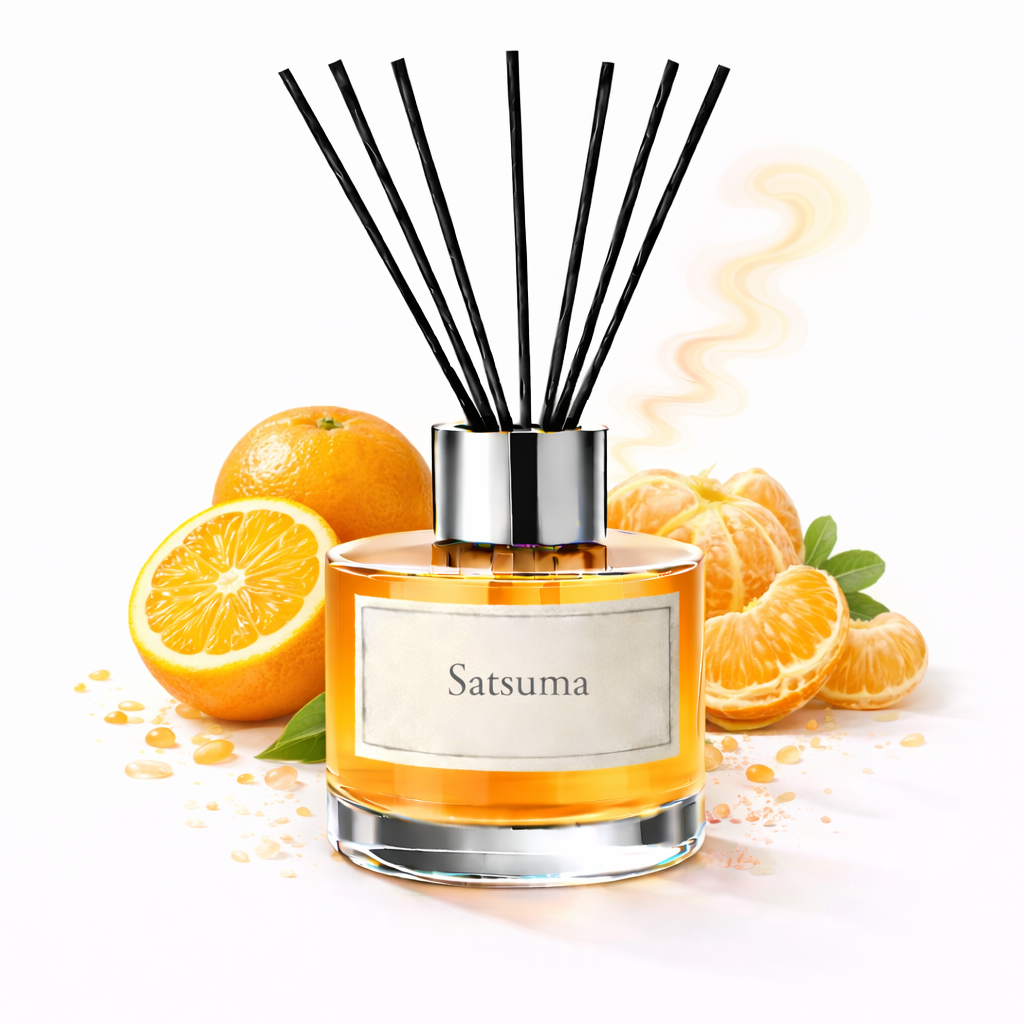 Reed diffuser labeled 'Satsuma' with oranges and orange slices on a white background