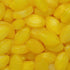 A close-up image of yellow, oval-shaped sherbet lemon candies.