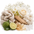 A styled arrangement of spa-like natural elements on a white background: a beige knit scarf, white flowers, a rose, baby's breath, a green kumquat fruit, a lime slice, amber crystal stones, and a piece of wood.