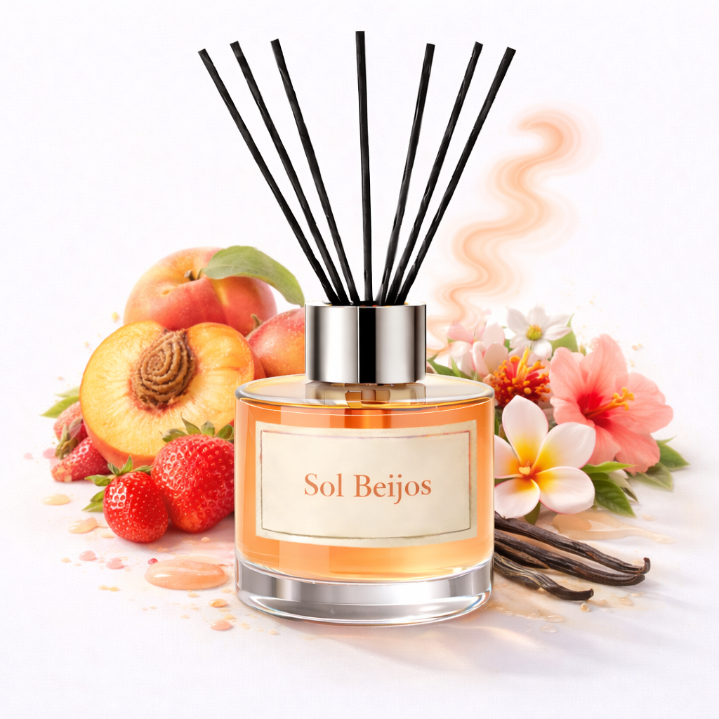 Reed diffuser with 'Sol Beijos' label surrounded by fruits, flowers, and vanilla beans on a white background