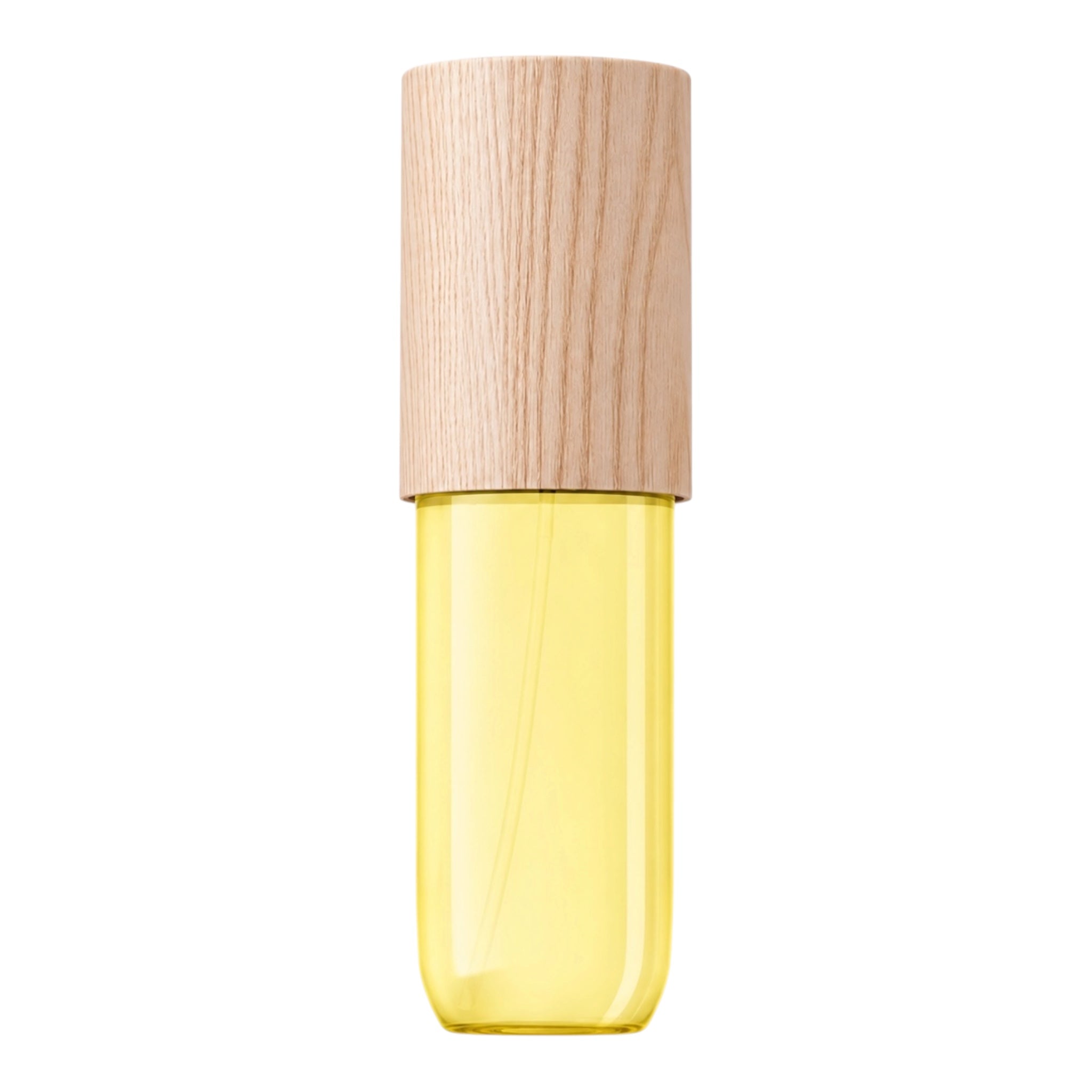 A small cylindrical cosmetic bottle with a light natural wood cap and a translucent yellow lower chamber, shown on a plain white background.