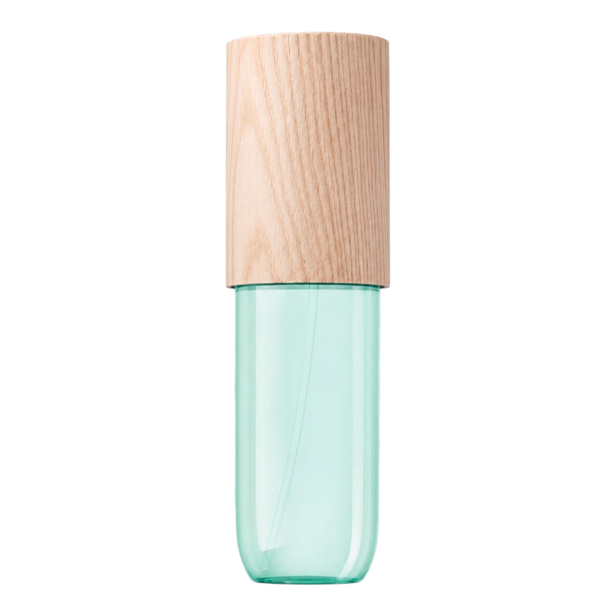 A cosmetic spray bottle with a translucent mint green glass body and a light natural wood cap, shown against a plain white background.