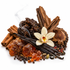 A styled arrangement of whole spices and botanicals on a white background, including cinnamon sticks, vanilla beans, star anise, cardamom pods, black peppercorns, amber jaggery pieces, a dried root, a wood slice, and a white orchid flower.