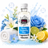 A bottle of Fizzy Whiz Spring Awakening Plus fragrance oil centered on a white background, surrounded by spring-themed props including blue flowers, a white lily, blue rose, lemons, a rolled towel, and blue beads.