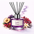 Reed diffuser labeled 'Sugar Plum' with fruit and floral elements on a white background