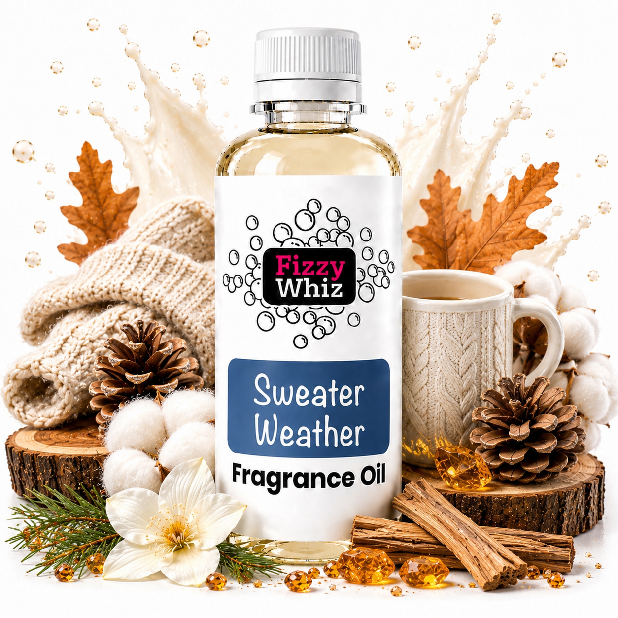 A bottle of Fizzy Whiz Sweater Weather Fragrance Oil centered in a styled holiday scene with a mug, cotton bolls, pinecones, cinnamon sticks, and warm autumn leaves on a white background.
