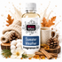 A bottle of Fizzy Whiz Sweater Weather Fragrance Oil centered in a styled holiday scene with a mug, cotton bolls, pinecones, cinnamon sticks, and warm autumn leaves on a white background.