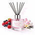 Reed diffuser labeled 'Sweet Like Candies' with berries and flowers on a white background