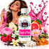 A bottle of Fizzy Whiz 'Touch of Pink' fragrance oil is centered, surrounded by pink and fruit-themed decorative elements including a woman spraying perfume, pink flowers, raspberries, vanilla beans, and citrus slices on a white background.
