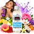 A bottle of Fizzy Whiz Toy 2 Pearl Fragrance Oil centered in a styled product composition, surrounded by fruit, flowers, ice cream, and a purple perfume spray bottle held by a woman in the background. The bottle has a white cap and a white label with black and pink branding.
