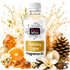 A bottle of Fizzy Whiz Twinkling Lights Fragrance Oil centered against a white background, surrounded by festive holiday props including white flowers, amber crystals, an orange slice, a pinecone, vanilla beans, and a lit candle. The bottle label is white with a gold panel and black text.