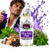 A bottle of Fizzy Whiz Ultra Violet Male Fragrance Oil is shown in the foreground with a white label and purple text, surrounded by fragrance-themed props including green mint leaves, brown seeds, crystals, and a purple liquid splash. A man in a black blazer and white shirt holds a purple perfume bottle in the background against a white studio backdrop.