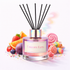 Reed diffuser labeled 'Unicorn Farts' with colorful candies and fruits on a white background