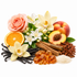 A styled arrangement of fragrance ingredients on a white background, including a peach rose, white orchids, a sliced orange, a peach, vanilla beans, cinnamon sticks, amber crystals, and white sugar.