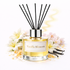 Vanilla Blossom diffuser with flowers and vanilla beans on a white background