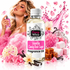 A bottle of Fizzy Whiz Vanilla Candy Rock Sugar fragrance oil is centered in a highly styled, vibrant pink promotional composition. A woman in a pink dress holds a perfume spray nearby, surrounded by pink crystals, vanilla flowers, marshmallows, and caramel pieces on a clean white background.