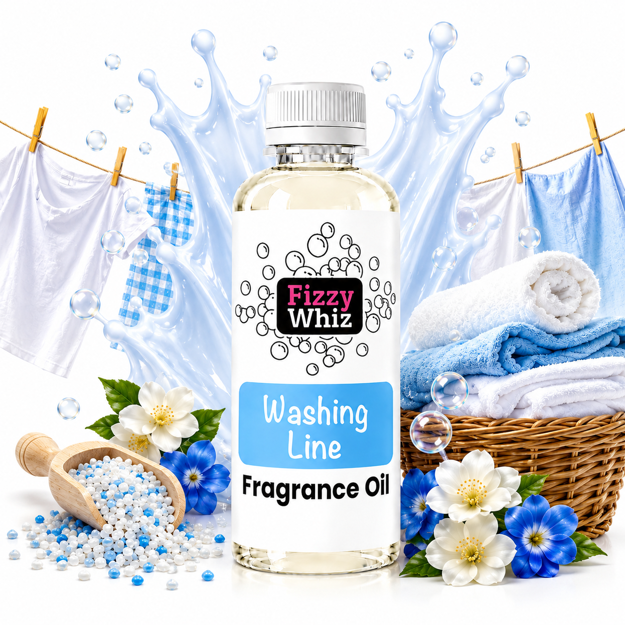 A bottle of Fizzy Whiz Washing Line Fragrance Oil centered on a white background with laundry-themed props including blue towels, flowers, a scoop of fragrance beads, and a basket. The bottle has a white cap and a white label with blue and black text.