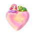 Heart-shaped soap with a mermaid and turtle figurine on a white background