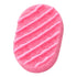 Pink oval-shaped soap sponge with white drizzle on a white background