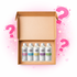 Set of fragrance oil bottles in an open cardboard box with pink question marks on a light pink background.